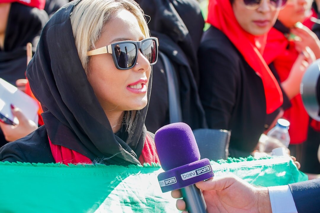 Journalist conducting an interview with a microphone outdoors