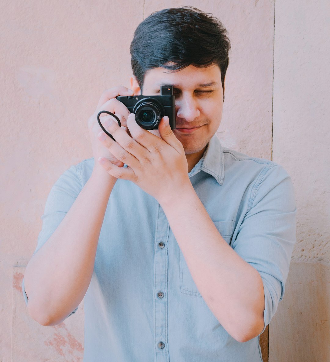 Professional portrait of a young male journalism trainer