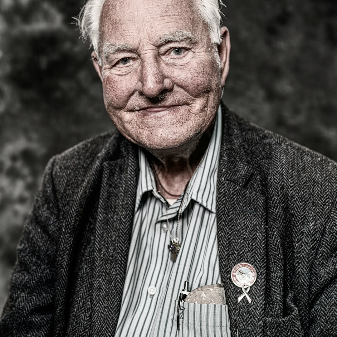 Professional portrait of a senior male journalism educator