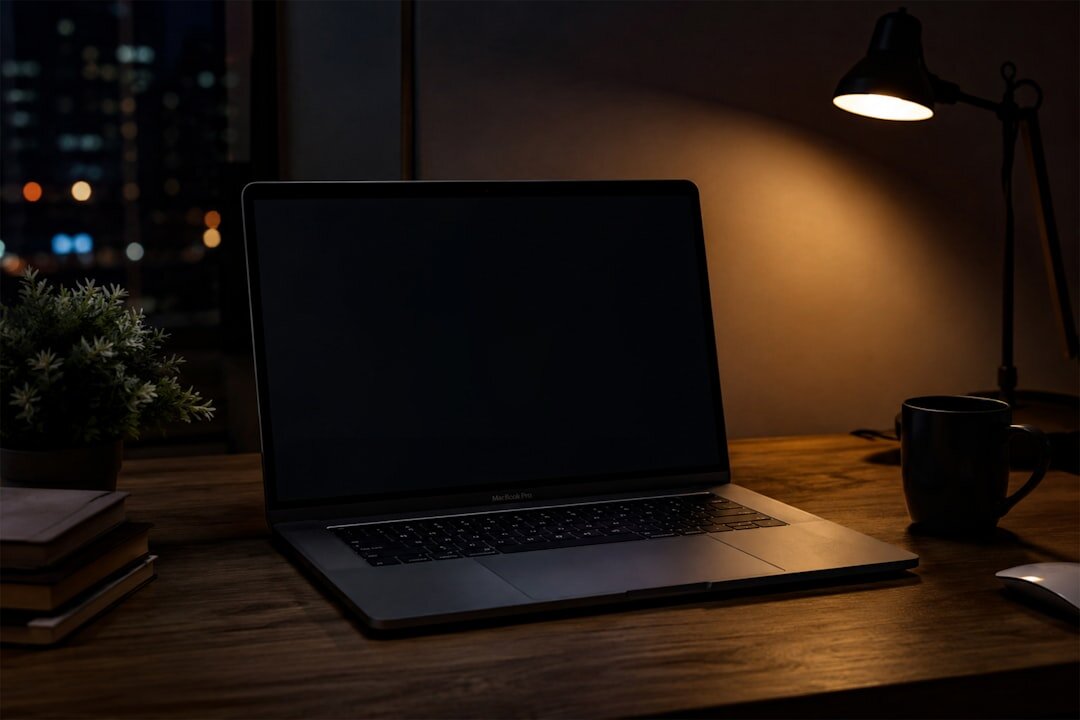 Journalist doing research with notebooks and laptop open on a wooden desk