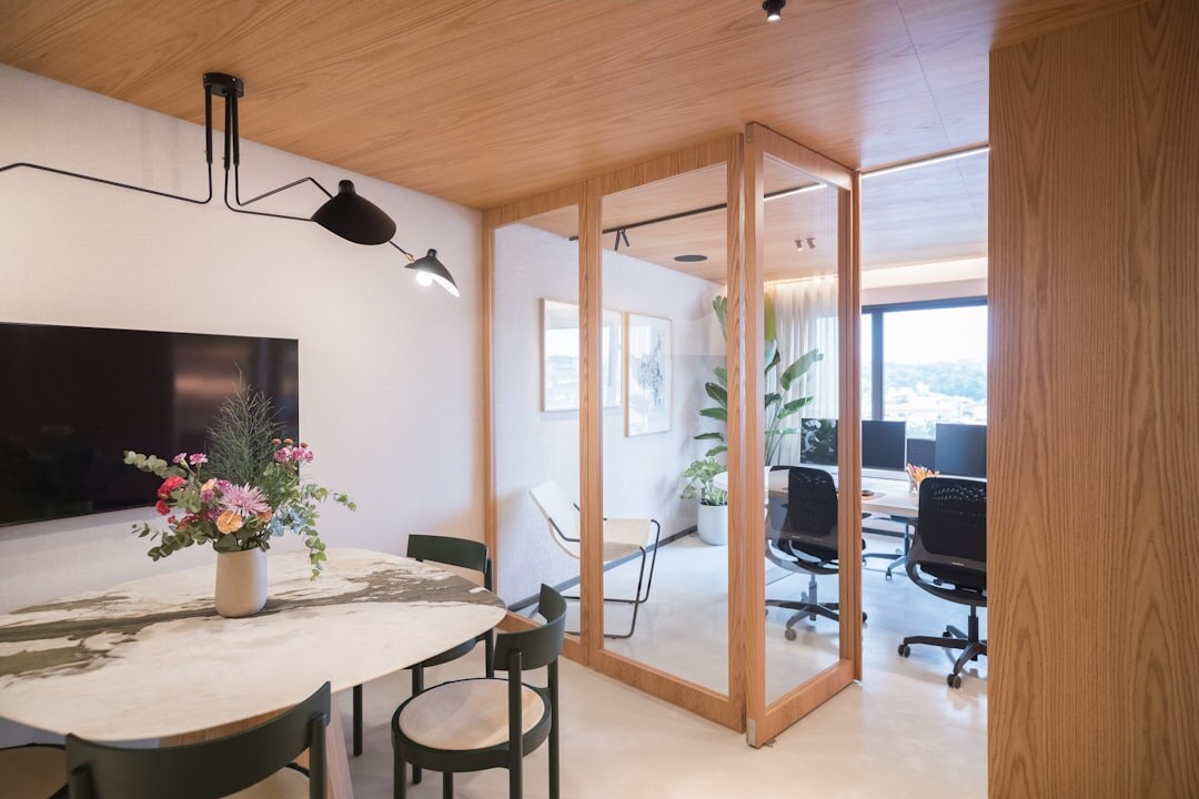Team of journalists collaborating around a conference table in a bright office